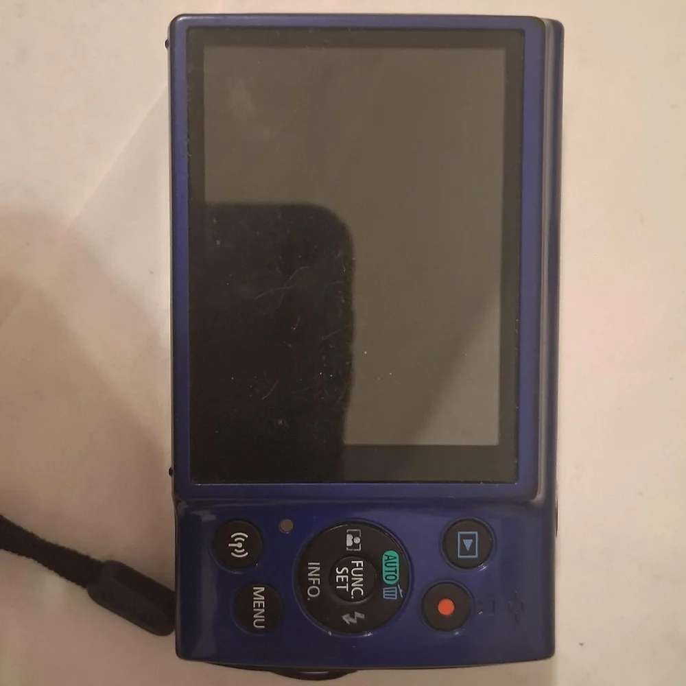 Canon Blue Digital Camera with Compact Design and Retractable Lens
